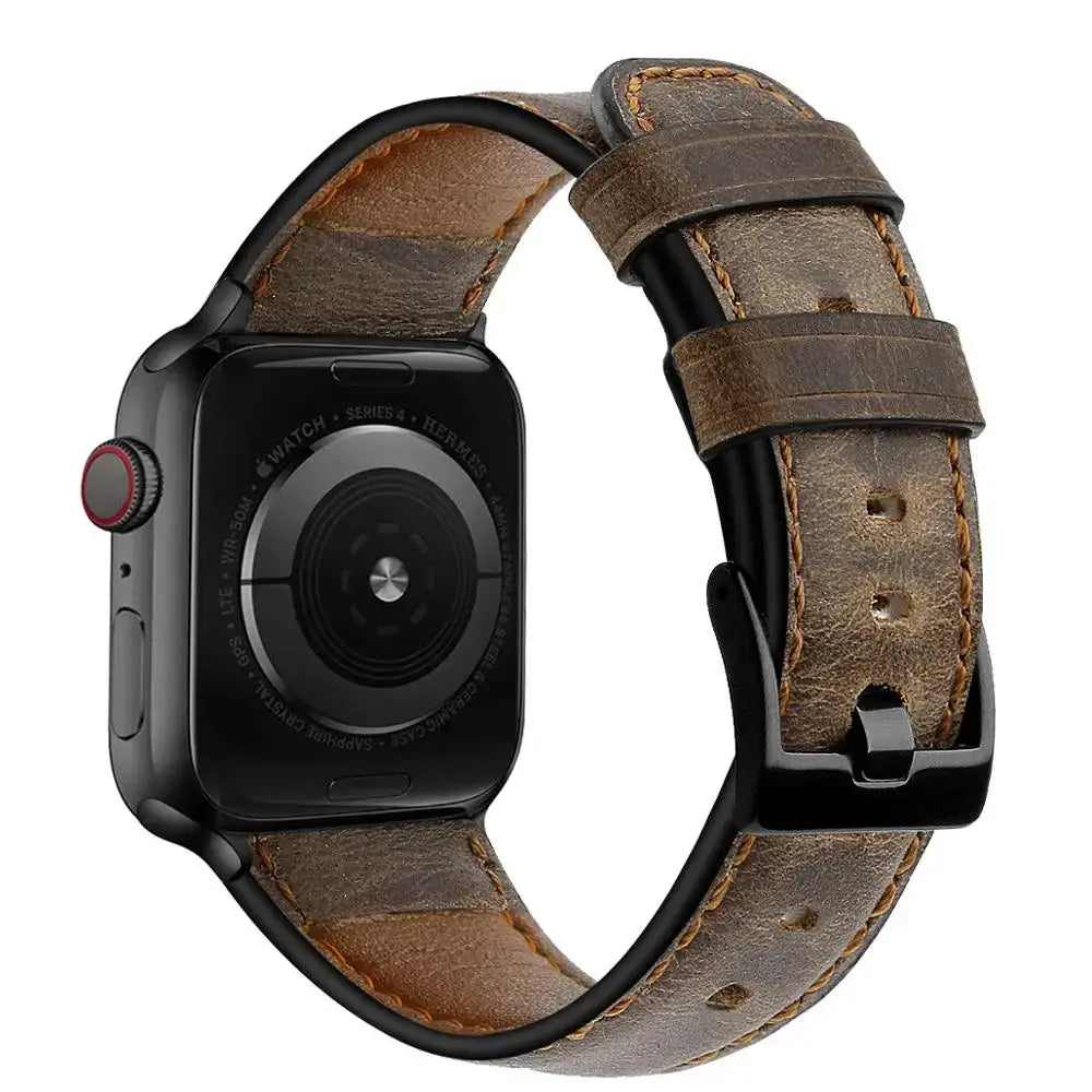 Distressed brown leather Apple Watch band showing buckle and strap keepers
