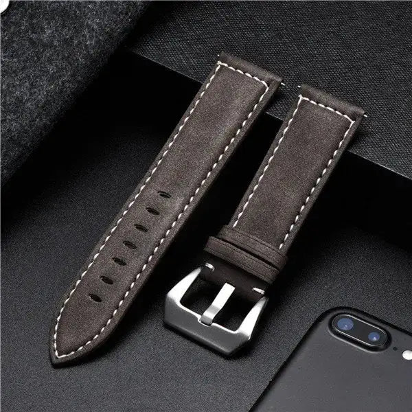 Durable leather Suunto watch band in dark brown with white stitching, perfect for secure daily wear.