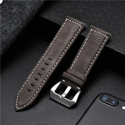 Durable leather Suunto watch band in dark brown with white stitching, perfect for secure daily wear.