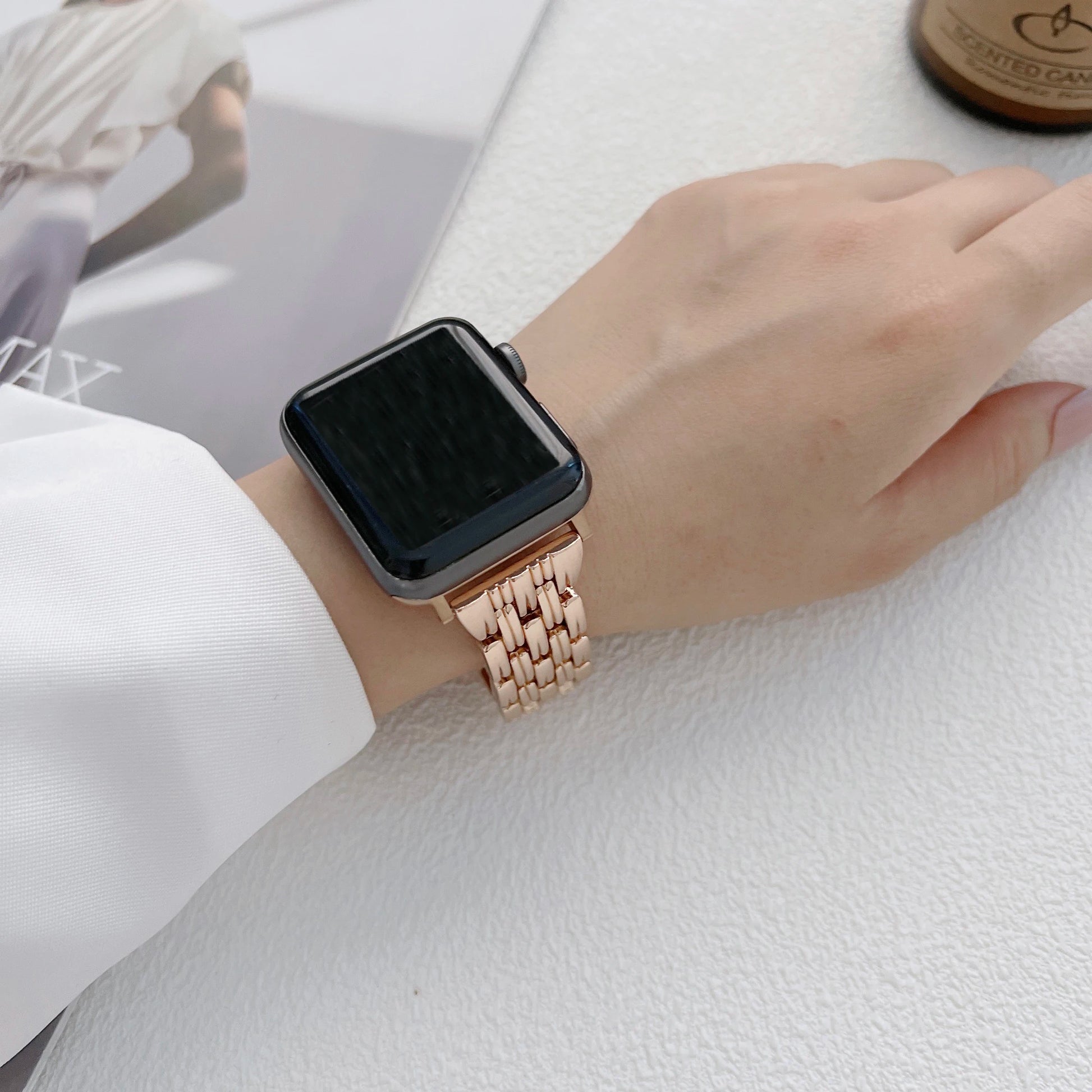Apple Watch with luxury diamond stainless steel band, showcasing elegance and style on a wrist.