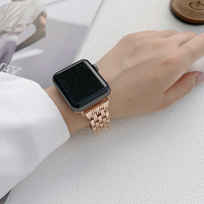 Apple Watch with luxury diamond stainless steel band, showcasing elegance and style on a wrist.