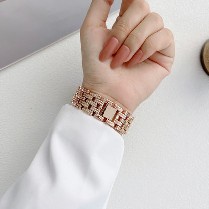 Elegant Apple Watch stainless steel band with luxury diamond design worn on a hand, showcasing its stylish look.