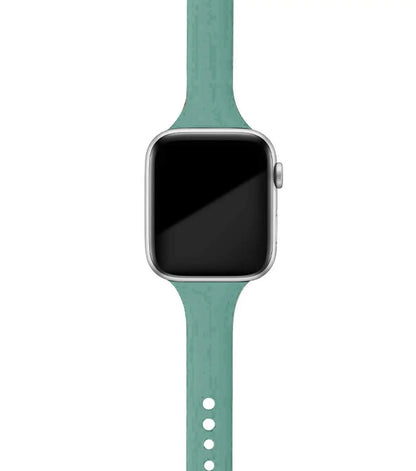 Apple Watch with a soft teal silicone band, designed for comfort and everyday style.