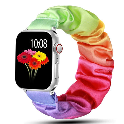 Apple Watch Scrunchie Strap in rainbow colors with flower display, soft elastic nylon loop band for comfort and style.