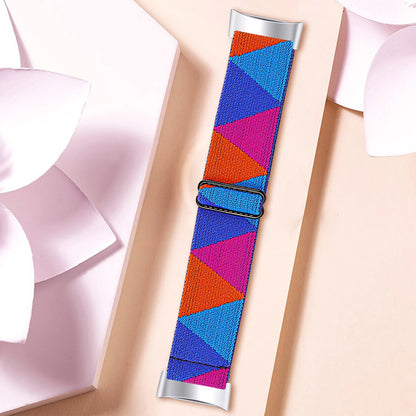 Colorful nylon strap for Fitbit Charge 6, featuring a geometric design, enhancing style and comfort for smartwatch users.