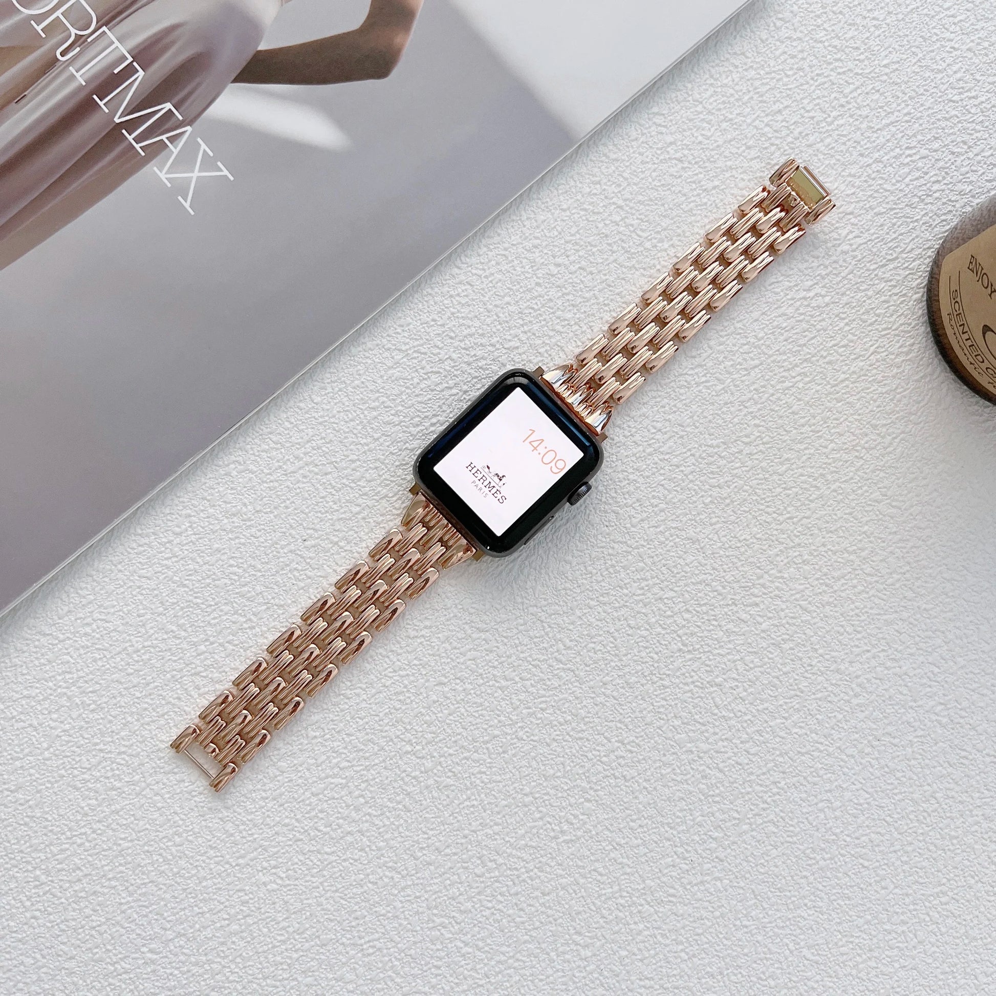 Apple Watch featuring a luxury diamond design stainless steel band on a stylish tabletop.