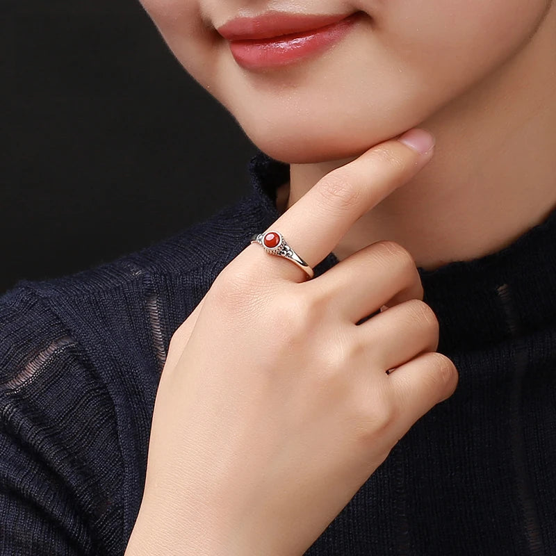 Carnelian oval ring worn on a finger