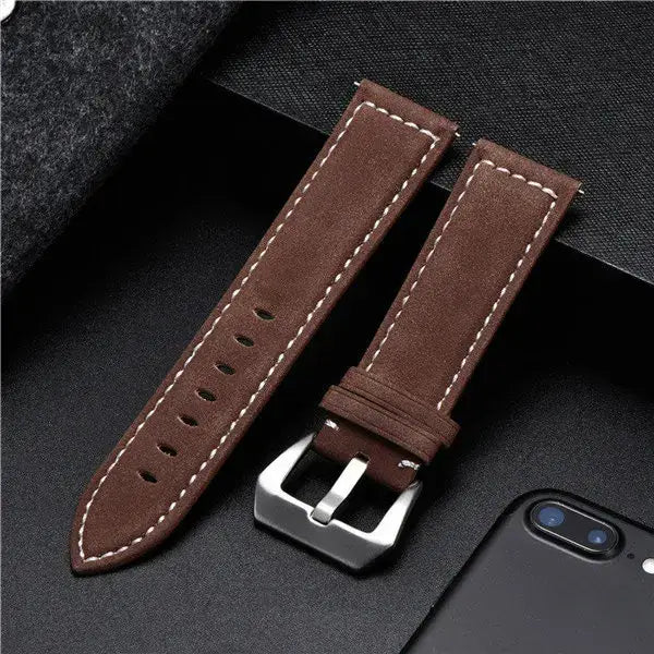 Brown leather Suunto watch band with silver buckle, designed for durability and style, perfect for everyday wear.