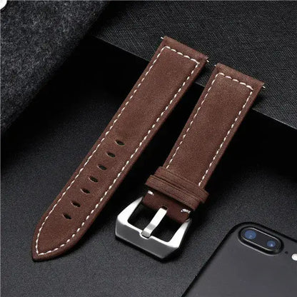 Brown leather Suunto watch band with silver buckle, designed for durability and style, perfect for everyday wear.