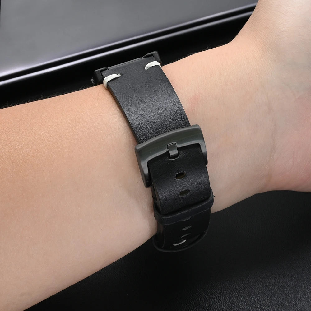 Garmin Leather Soft Strap on wrist, highlighting premium comfort and adjustable fit for smartwatch.