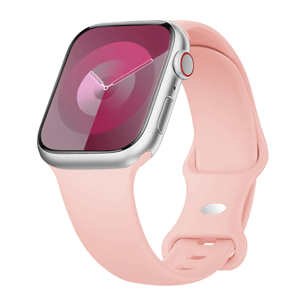 Apple Watch with soft pink silicone strap, showcasing its flexible and waterproof design for comfort and style.