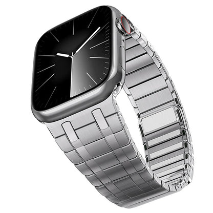 Apple Watch with a magnetic stainless steel band in premium titanium color, showcasing its sleek design and modern style.