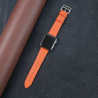Orange Apple Watch Fabric Band on a black background, showcasing durability and style with a metal buckle clasp.