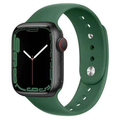 Apple Watch with green silicone strap, featuring a sleek design and comfortable fit for daily wear.
