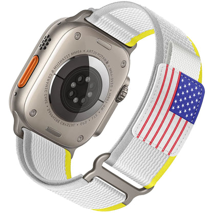 Apple Watch with Rugged Trail Loop Nylon Band featuring adjustable white strap and American flag design.
