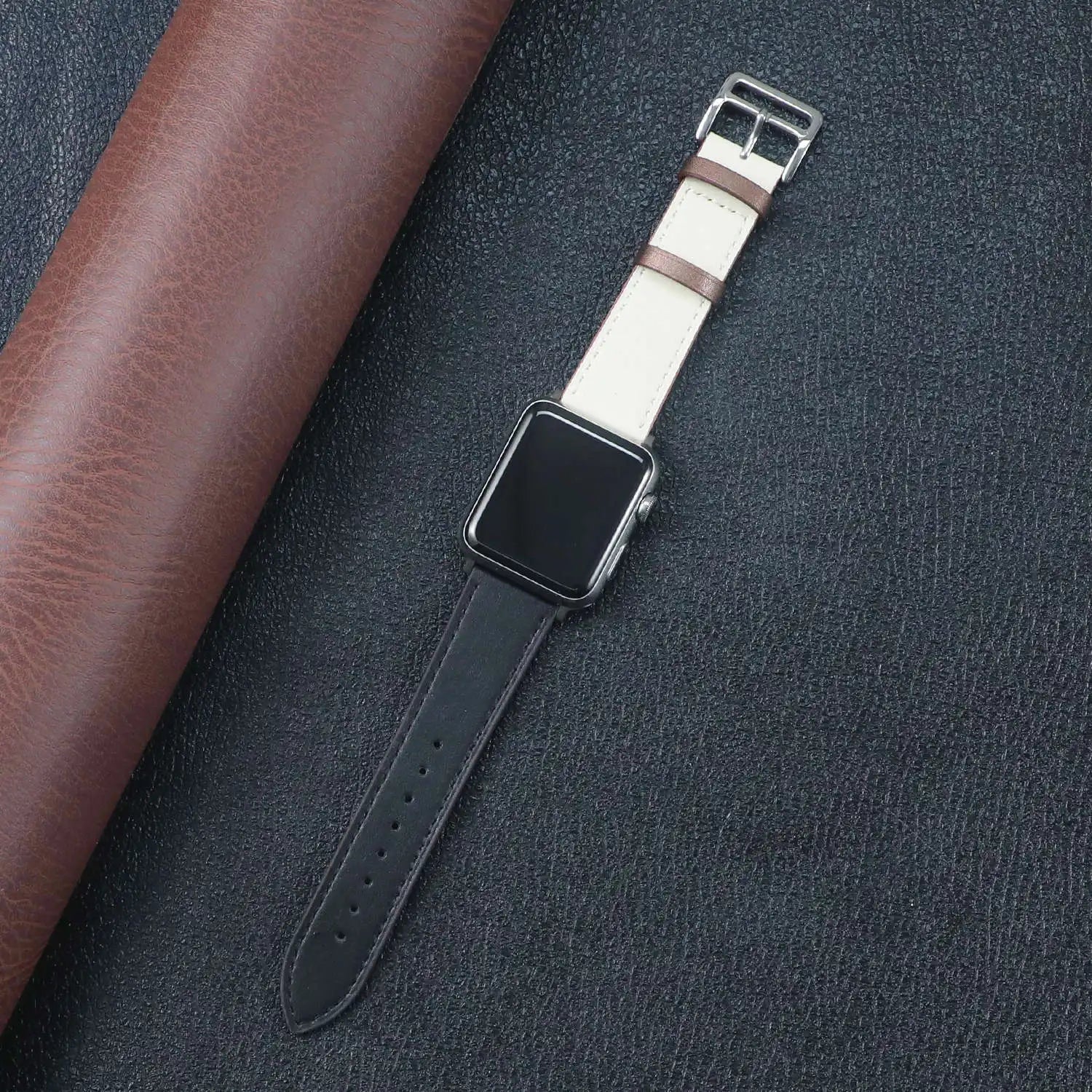 Apple Watch Fabric Band in black and cream, showcasing style, comfort, and a secure metal buckle clasp.