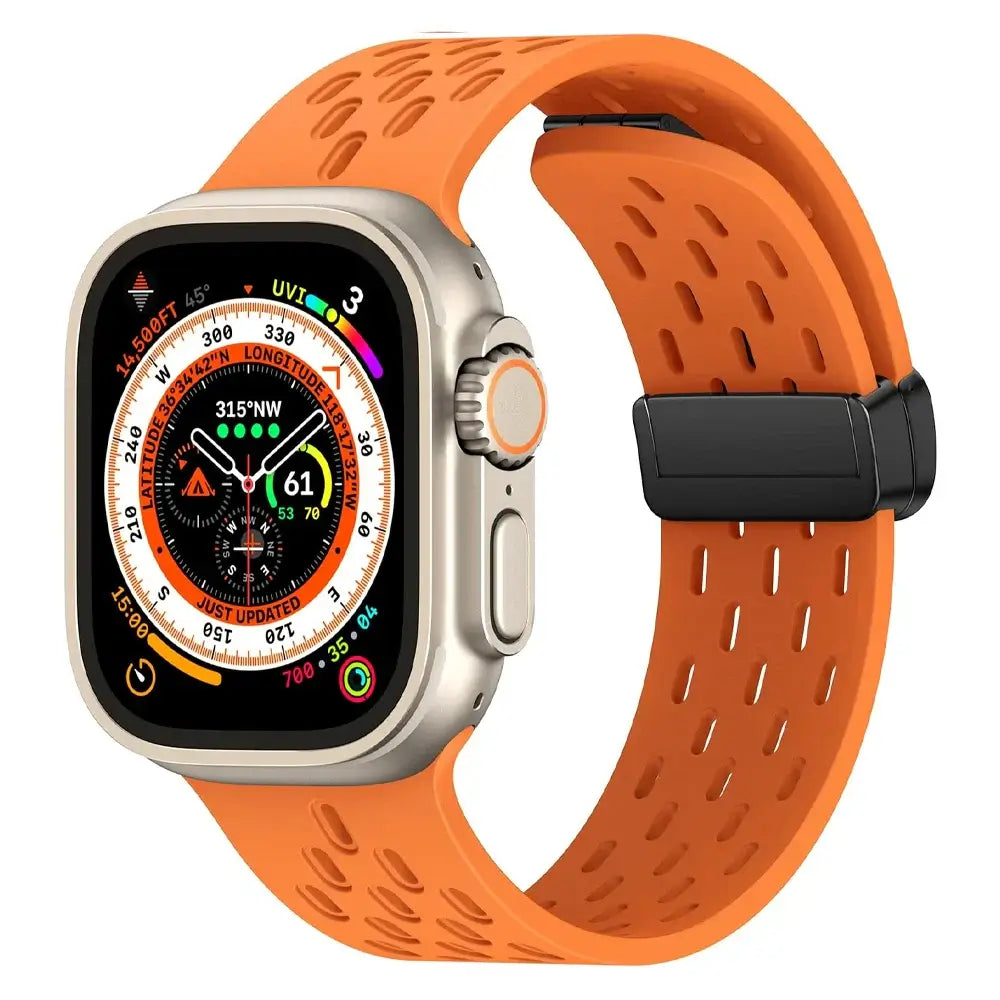 Orange perforated silicone Apple Watch band front view
