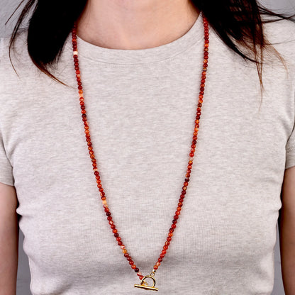 Long carnelian bead necklace worn, front view