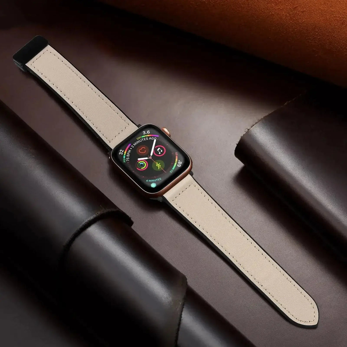 Beige stitched leather Apple Watch band laid flat
