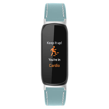 Fitbit Inspire 3 smartwatch with a blue leather band displaying cardio tracking message.