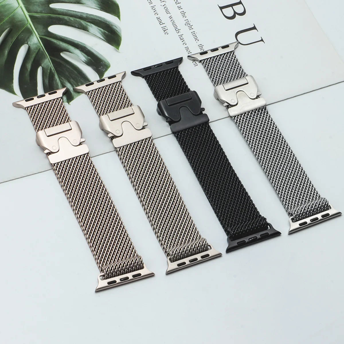Mesh bands displayed in several metallic finishes for Apple Watch