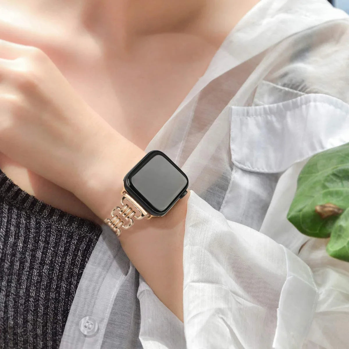 Sleek Apple Watch with luxury metal chain strap worn on wrist, showcasing elegant design and comfort.