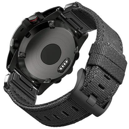 Garmin smartwatch featuring a durable black woven nylon sport band with secure G-hook closure.
