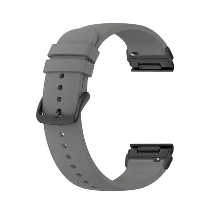 Garmin silicone watch strap in gray, flexible, durable replacement band for smartwatch with quickfit connectors.