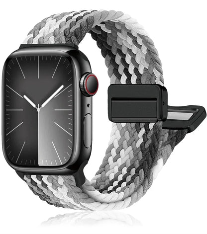 Apple Watch with braided nylon band in black and white, showcasing style, comfort, and durability for all-day wear.