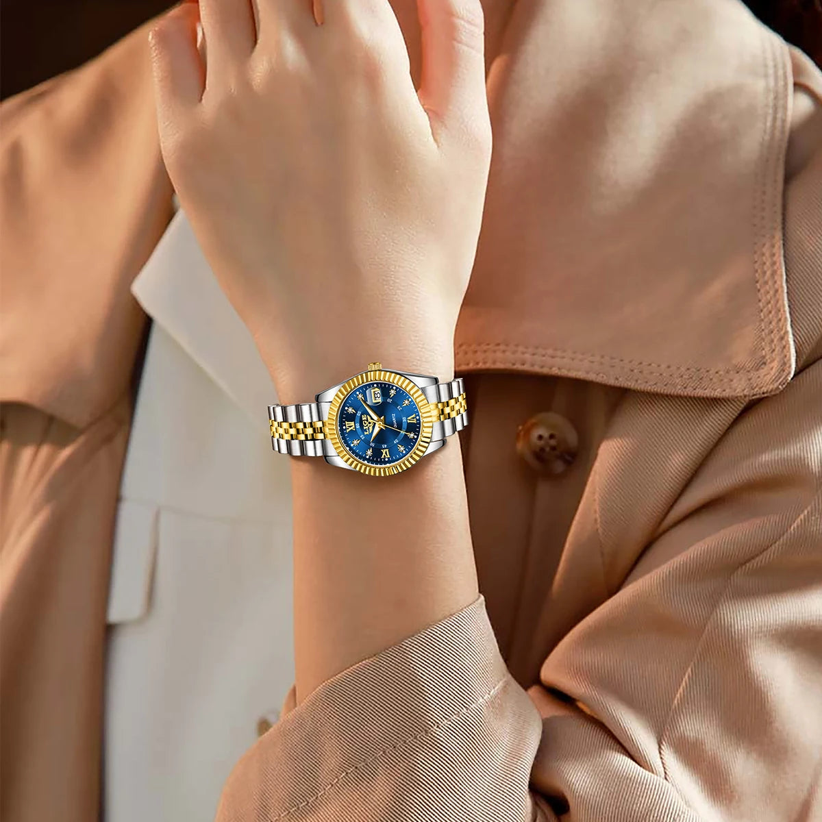 Women's 27mm Fluted Bezel Quartz Date Watch — Two-tone blue dial watch worn on wrist