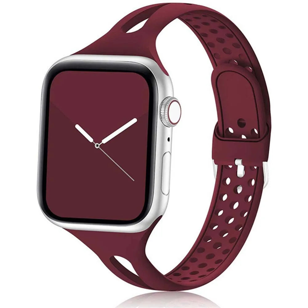 Apple Watch with maroon silicone strap showcasing breathable and flexible design for all-day comfort.