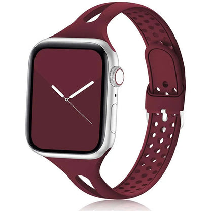 Apple Watch with maroon silicone strap showcasing breathable and flexible design for all-day comfort.