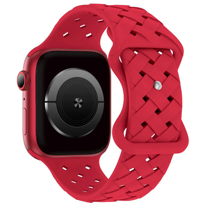 Red Apple Watch silicone strap with breathable, woven design for active lifestyles and all-day comfort.