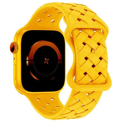 Bright yellow braided silicone strap for Apple Watch, sporty and breathable design for active lifestyles.