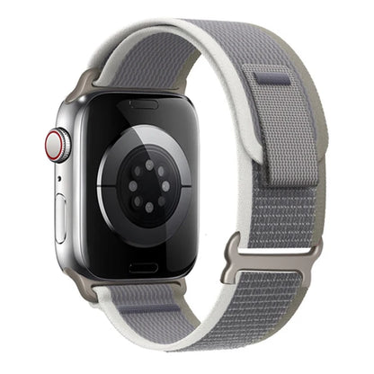 Apple Watch with Trail Loop Nylon Strap in gray, showing durability and comfort for everyday and adventurous wear.
