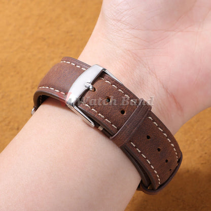 Vintage Stitched Leather Band in dark brown worn on a wrist