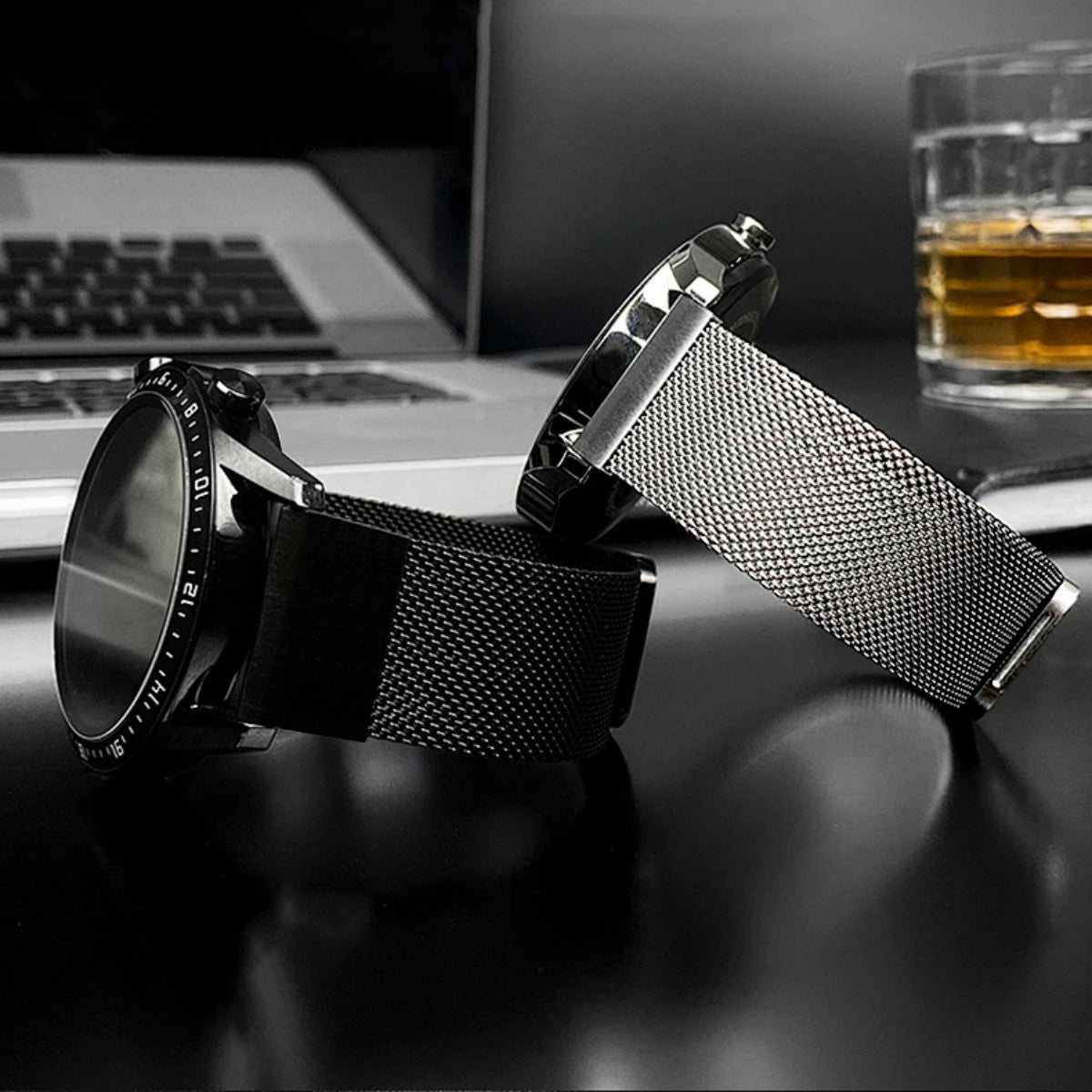 Garmin smartwatch with stainless steel and mesh band, featuring a sleek design and durable replacement strap.