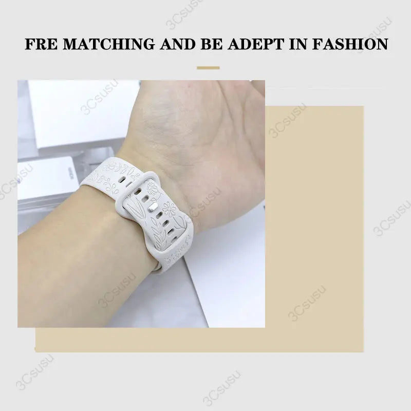 Garmin Rose Engraved Silicone Band in white worn on a wrist