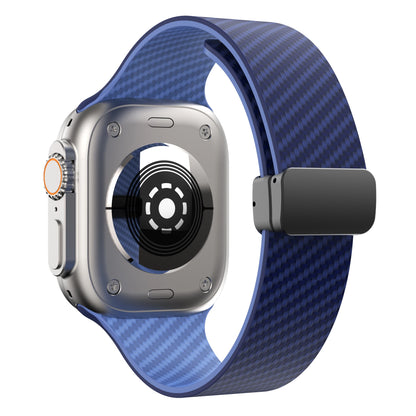 Apple Watch with a blue silicone strap and magnetic buckle, showcasing a durable design for comfort and security.