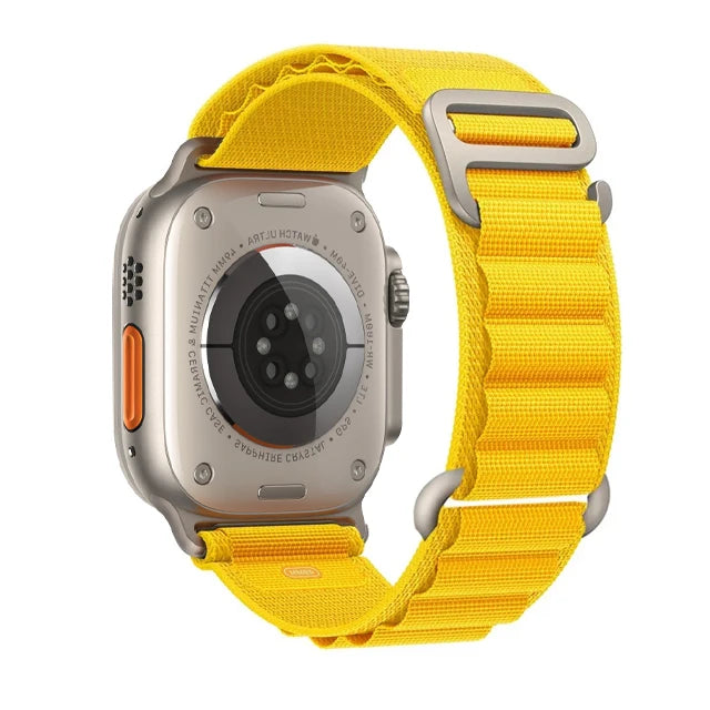 Apple Watch with rugged yellow nylon strap, showcasing durable design for outdoor activities and adjustable fit.
