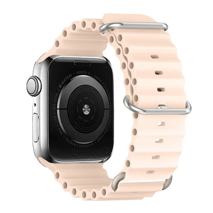 Apple Watch with a waterproof and breathable silicone strap in soft peach color, perfect for sports and daily wear.