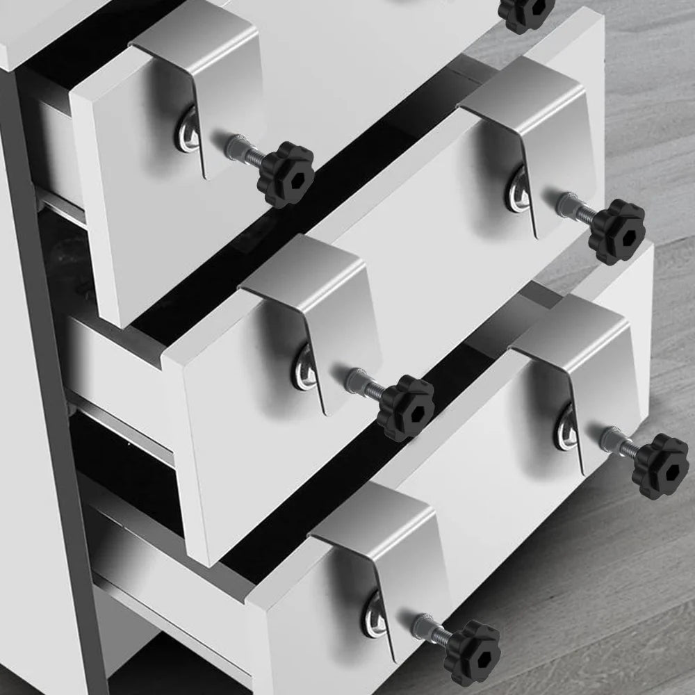 Drawer front clamps holding drawer fronts on a cabinet