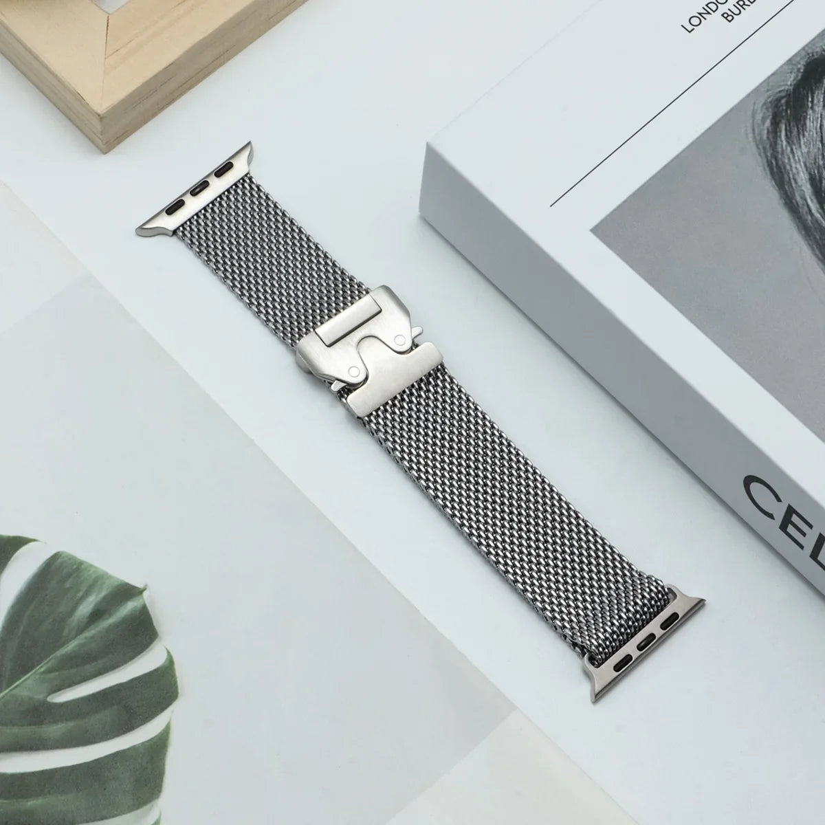 Silver mesh band displayed flat for Apple Watch