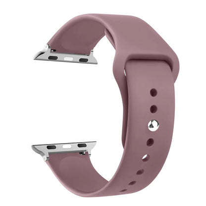 Apple Watch silicone strap in soft pink, comfortable and waterproof band for all-day wear.