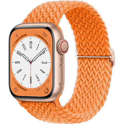 Apple Watch with orange braided strap, featuring a soft elastic nylon band for ultimate comfort and style.