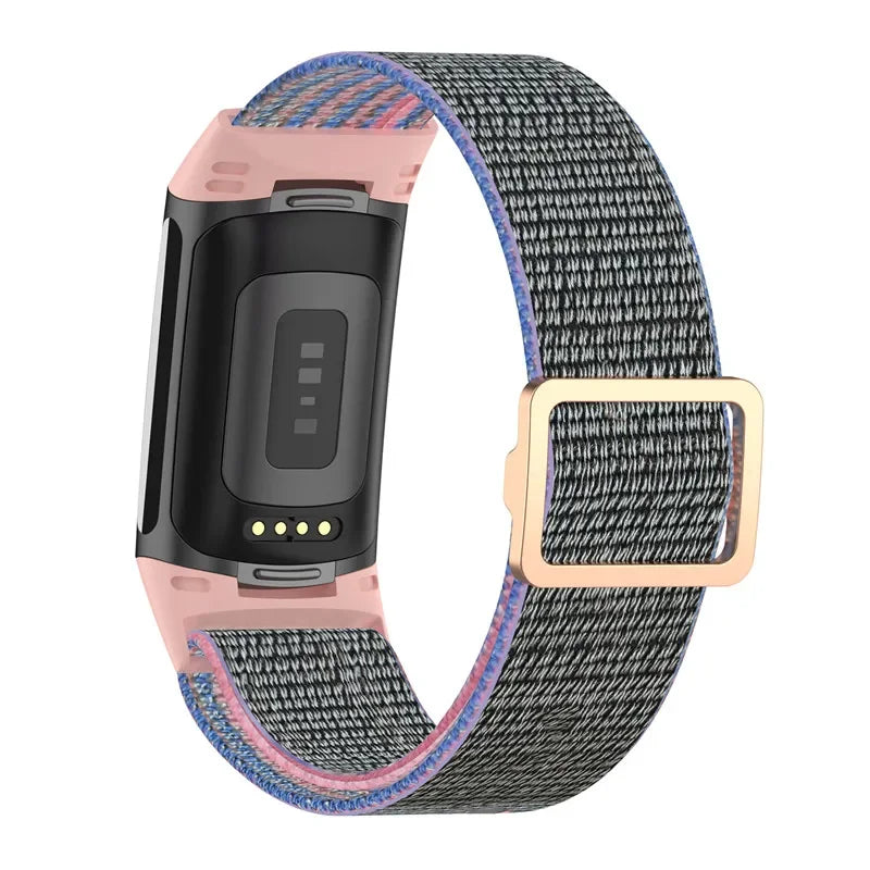 Fitbit Charge 5 elastic nylon loop band in grey with pink accents, ideal for smartwatch straps and daily wear.