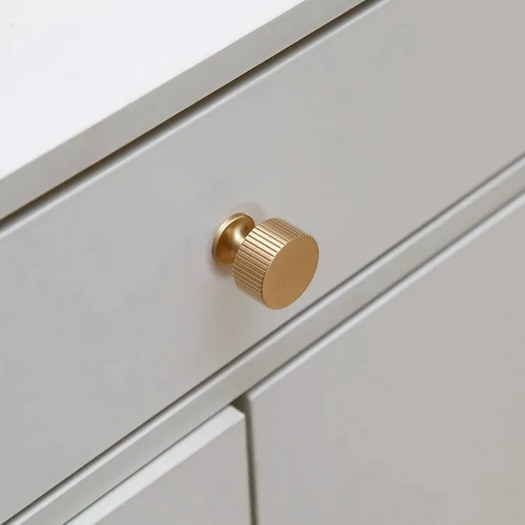 Fluted solid brass round cabinet knob in brushed brass