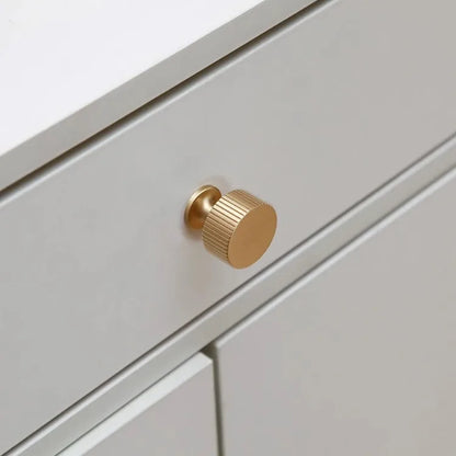 Fluted solid brass round cabinet knob in brushed brass