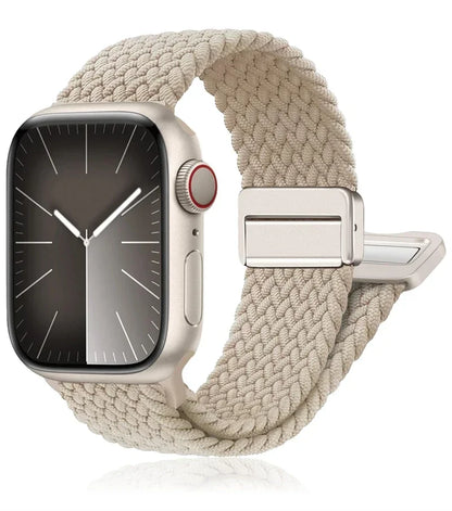 Apple Watch with braided nylon band in beige, featuring a stainless steel buckle for optimal comfort and style.