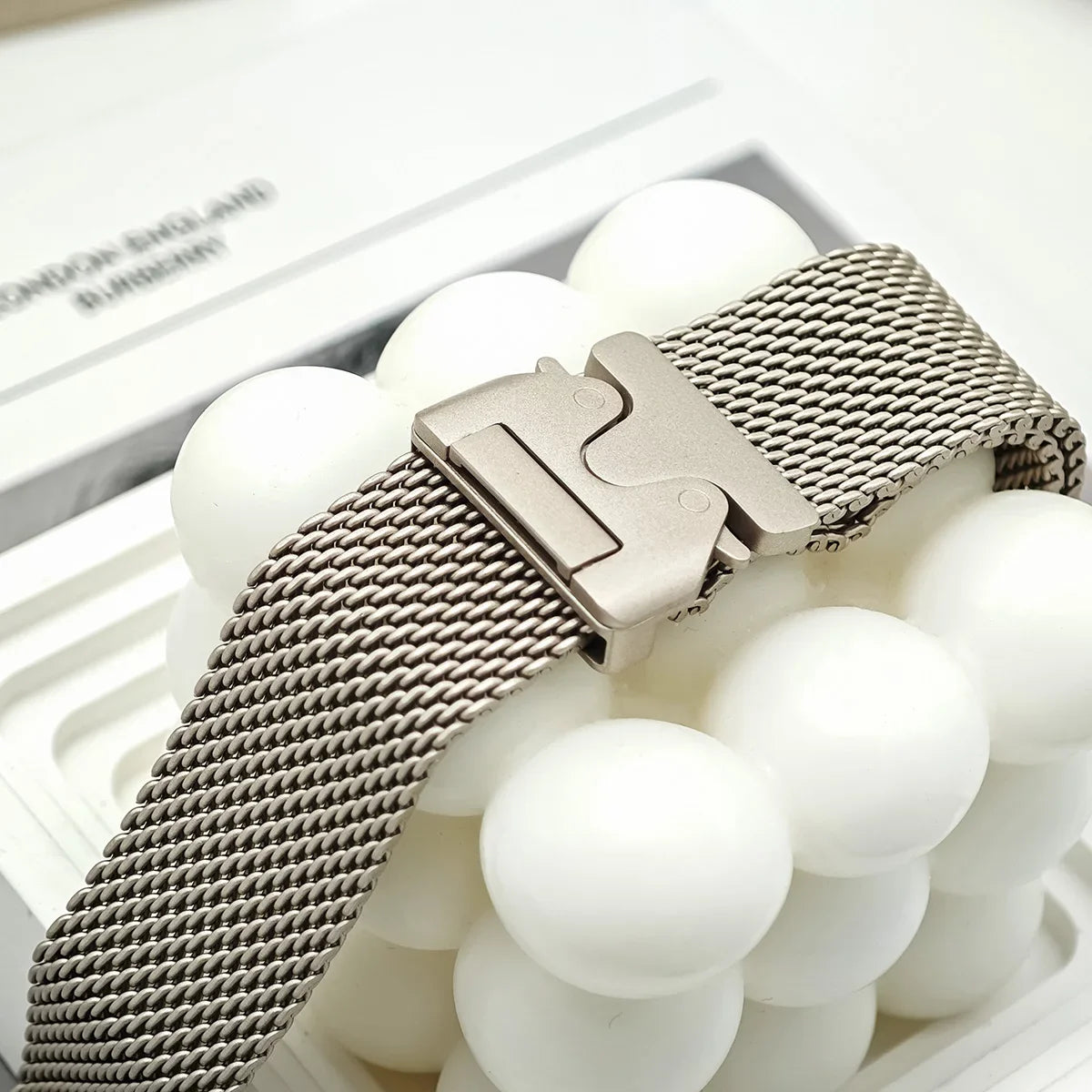 Clasp and woven mesh detail on display for Apple Watch